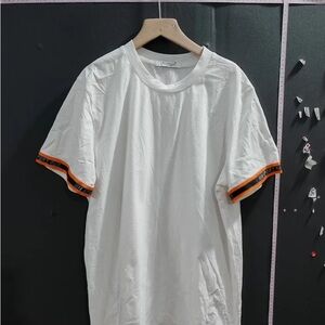 White T-Shirt with Orange Accents